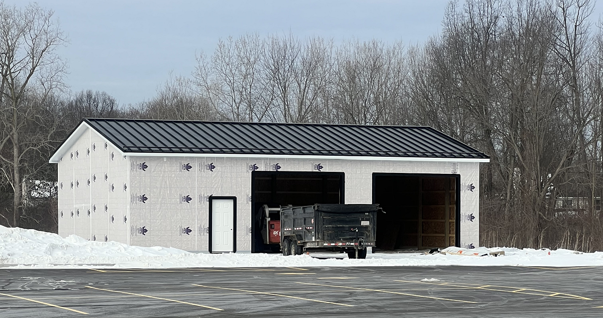 Pole barn construction in Brownstown Township MI with a metal standing seam roof installed